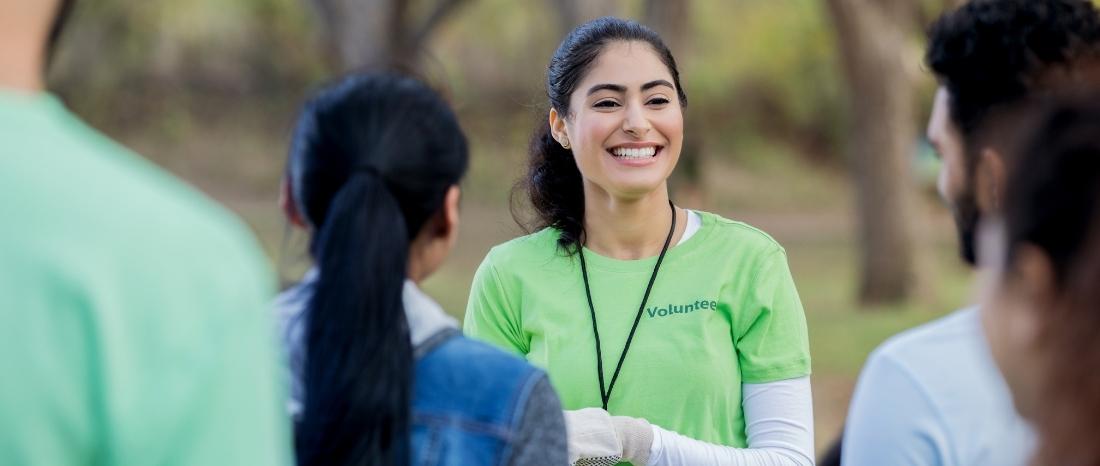 woman in green volunteer shirt